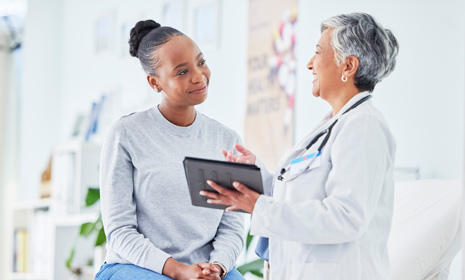 Clinician discussing medical information with patient